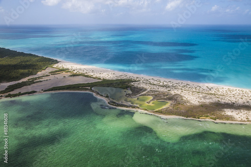 Aerial view of a corner of Barbuda, the Frigate Bird Sanctuary touches a thin strip of sand that separates the Caribbean Sea, Barbuda, Antigua and Barbuda, Leeward Islands #88341608