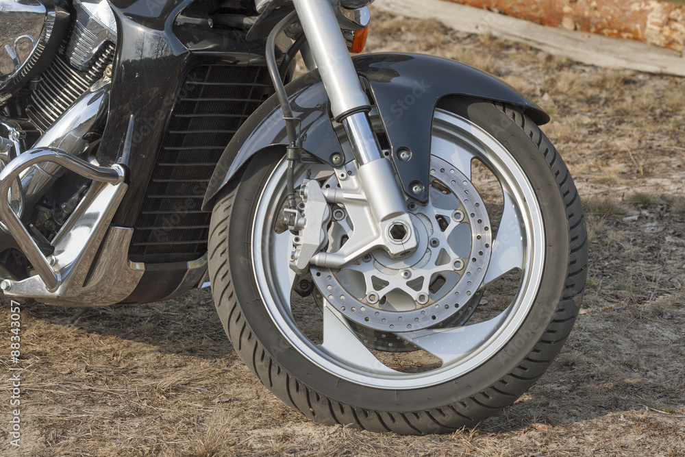 Obraz premium motorbike front wheel with brake system closeup