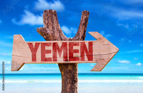 Yemen wooden sign with coast background