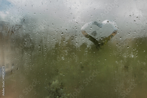 Raindrops on glass. Sorrow.