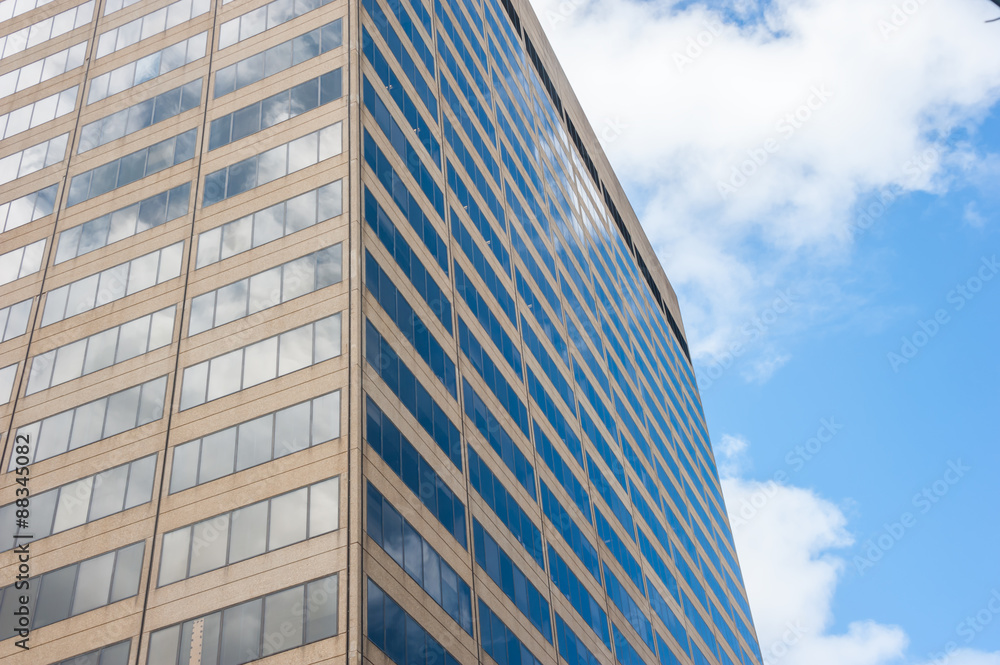Close-up of facade of office building with sky reflection. Close-up of facade of office building with sky reflection.