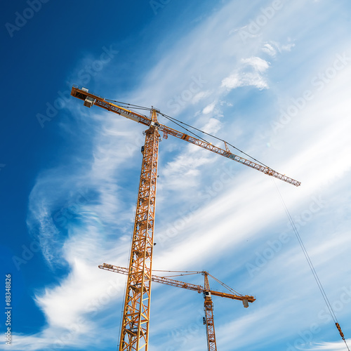 Cranes Working on Construction Site