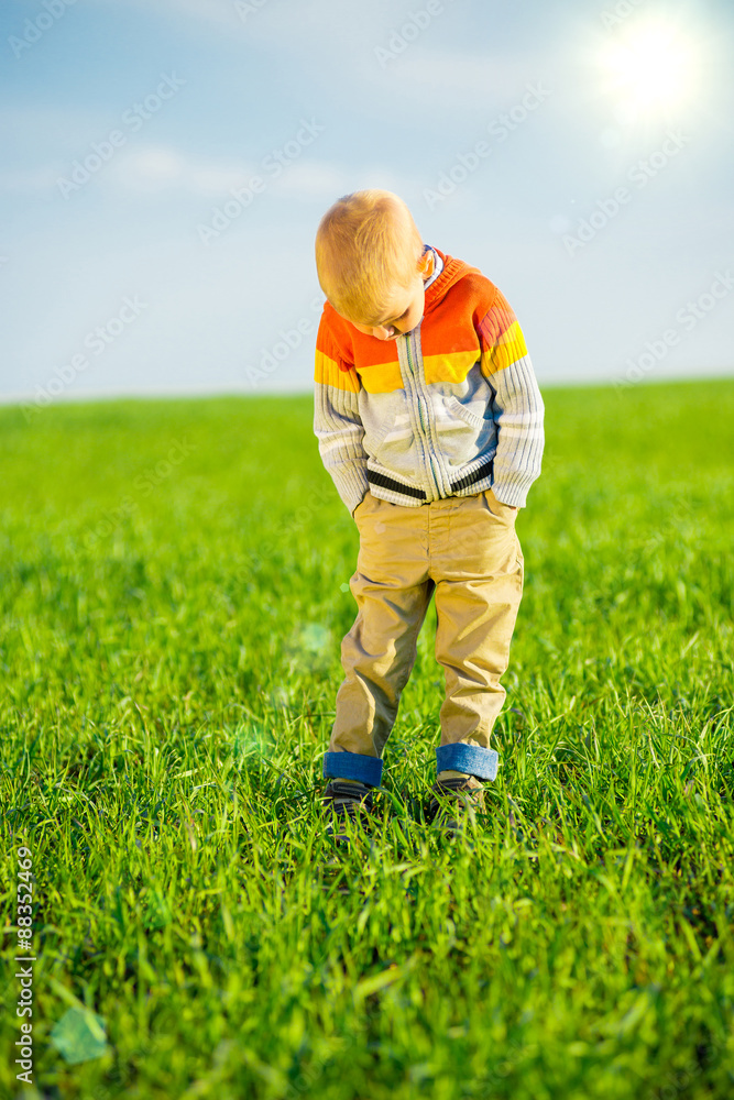 Portrait of happy joyful beautiful little boy outdoor at