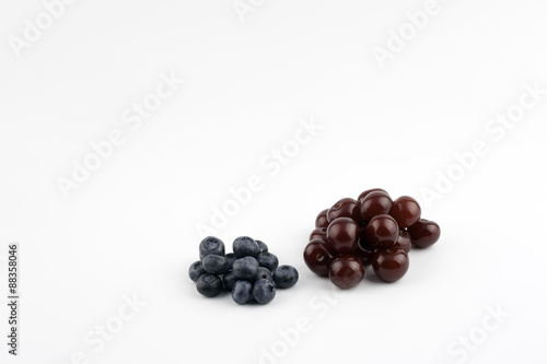 Cherries and blueberries on a white background