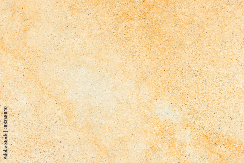Fototapeta Pale orange concrete wall texture background, paint partly faded