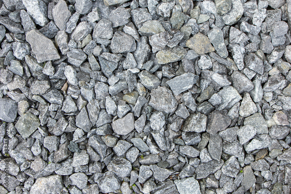 Crushed grey stone on the ground texture background Crushed grey stone on the ground texture background
