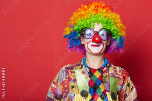 funny clown with glasses on red