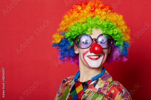 funny clown with glasses on red