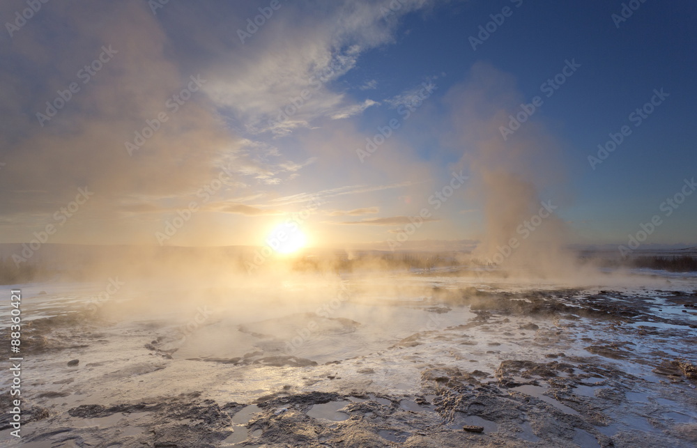 Steam rising from geothermal pools at sunrise in winter, Geysir, Haukardalur Valley, Iceland Steam rising from geothermal pools at sunrise in winter, Geysir, Haukardalur Valley, Iceland