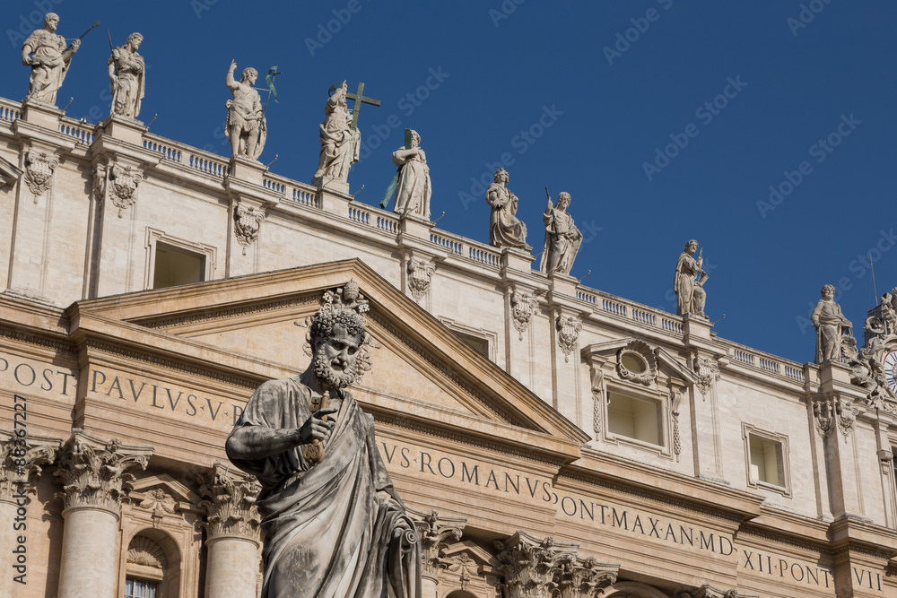 Statue and the facade of the Basilica of St. Peter's, Vatican, Rome, Lazio Statue and the facade of the Basilica of St. Peter's, Vatican, Rome, Lazio