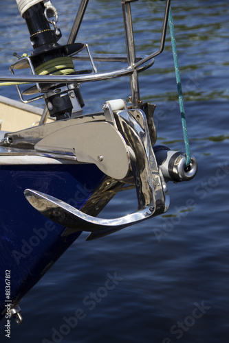 nautical part of a yacht with cords, rigging, sail, mast, anchor, knots © yos_moes