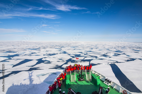 Expedition boat navigating through the pack ice in the Arctic shelf, Svalbard, Arctic