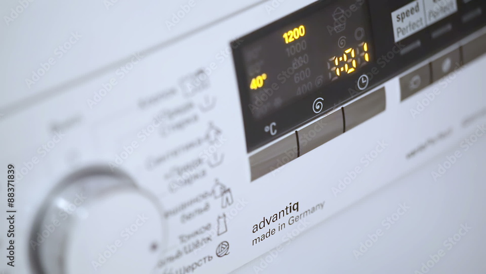 Hand Turning Washing Machine Appliance Dial Hand Turning Washing Machine Appliance Dial