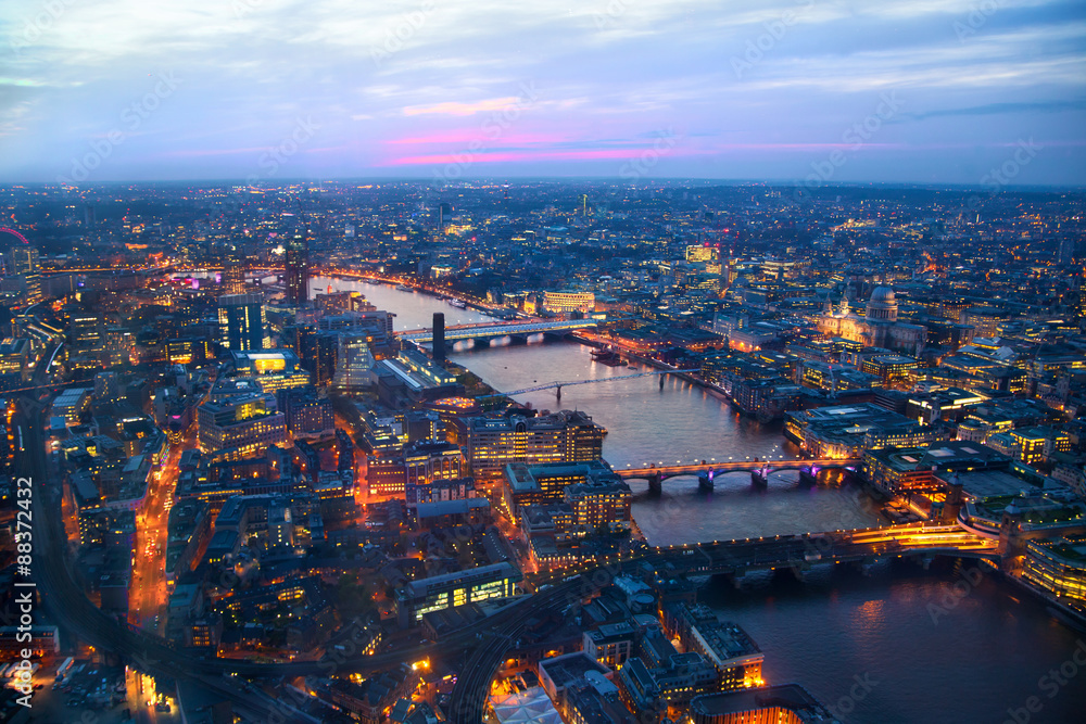 LONDON, UK - APRIL 15, 2015: City of London panorama in sunset and first night lights.
