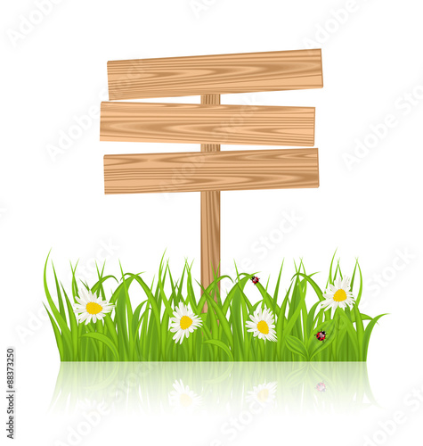 Wooden signboard for guidepost with field green grass and camomi
