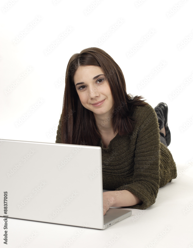 Attractive young woman lying on the floor with her laptop. Attractive young woman lying on the floor with her laptop.