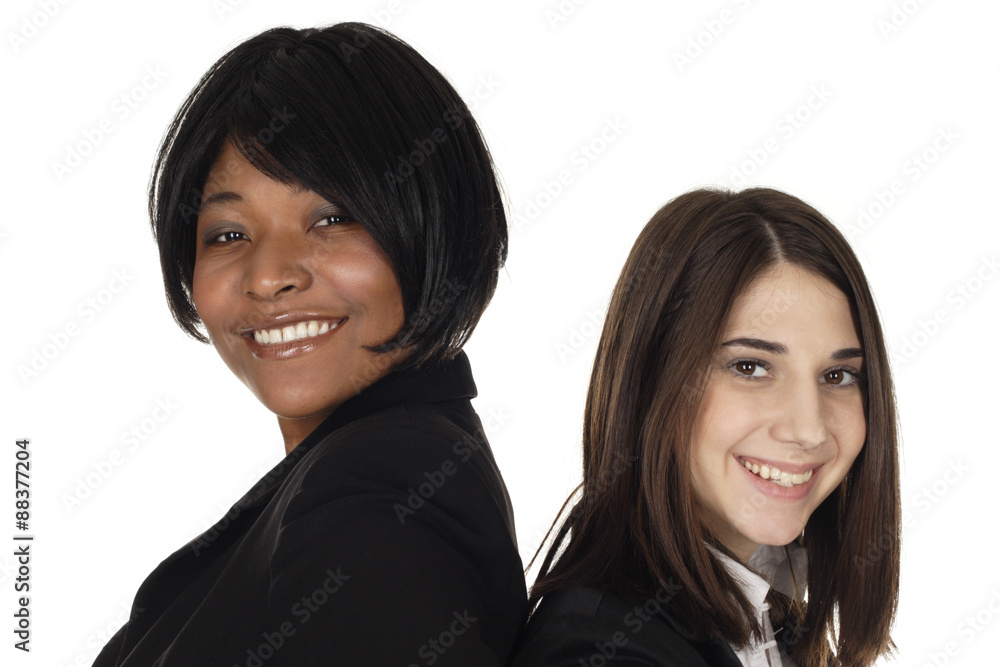 Closeup of two women's faces smiling.