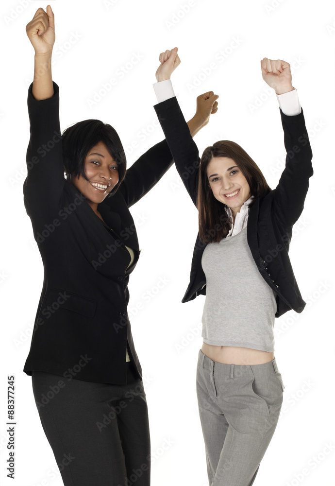 Two women raising arms in joy. Two women raising arms in joy.