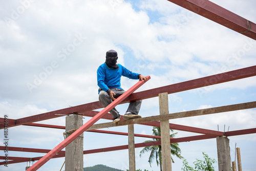 labor working in construction site for roof