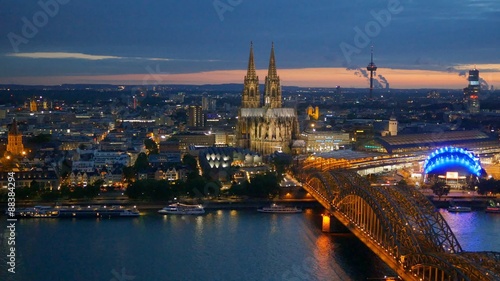 Cologne Cathedral and Hohenzollern Bridge. Cologne, Germany. Panning shot photo