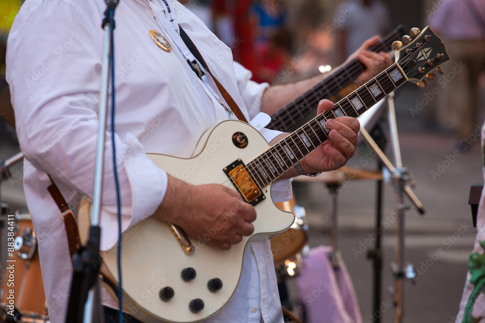Guitar player during the street concert Guitar player during the street concert