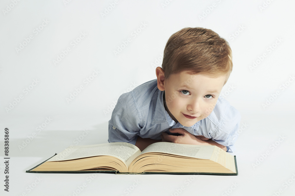 education and school concept.little boy with book on the floor.child education and school concept.little boy with book on the floor.child