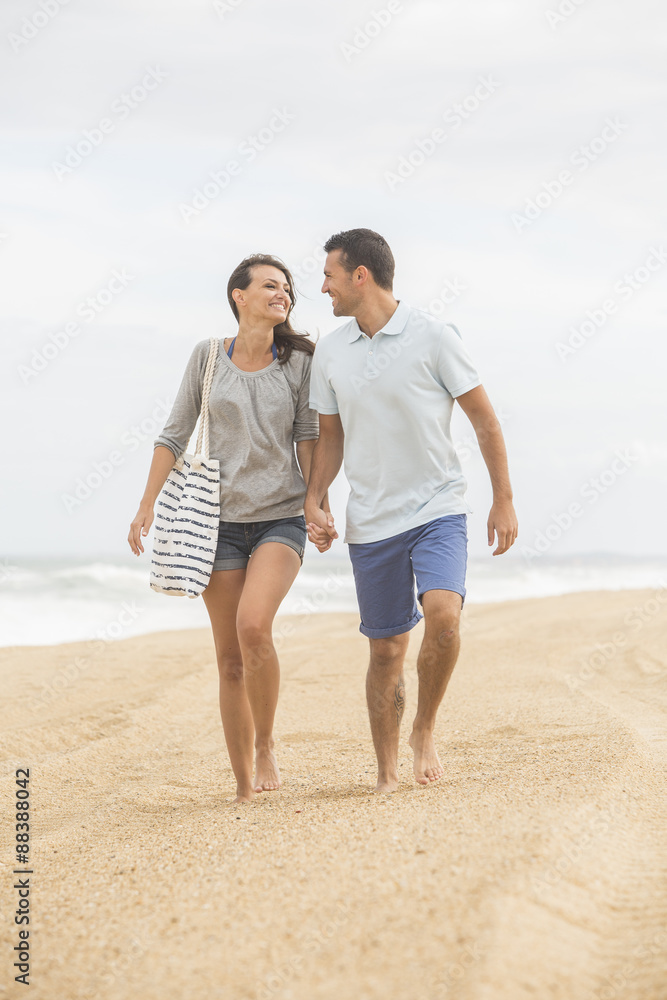 portrait of living young couple at the beach portrait of living young couple at the beach