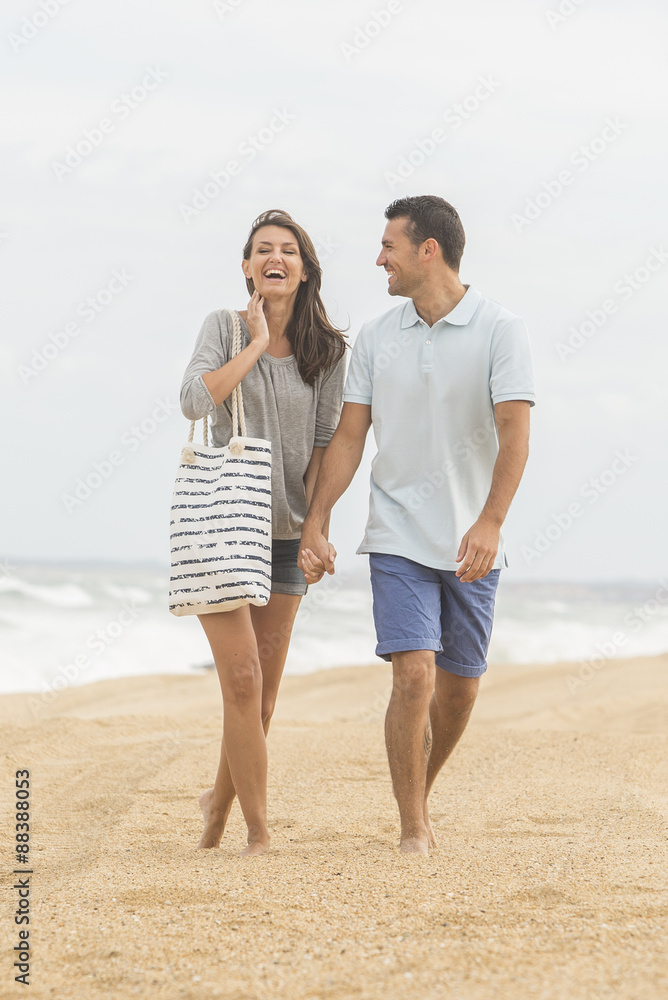 portrait of living young couple at the beach portrait of living young couple at the beach