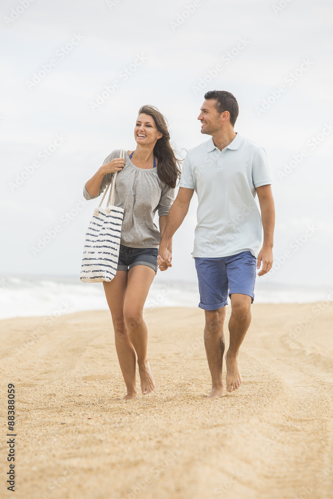 portrait of living young couple at the beach portrait of living young couple at the beach