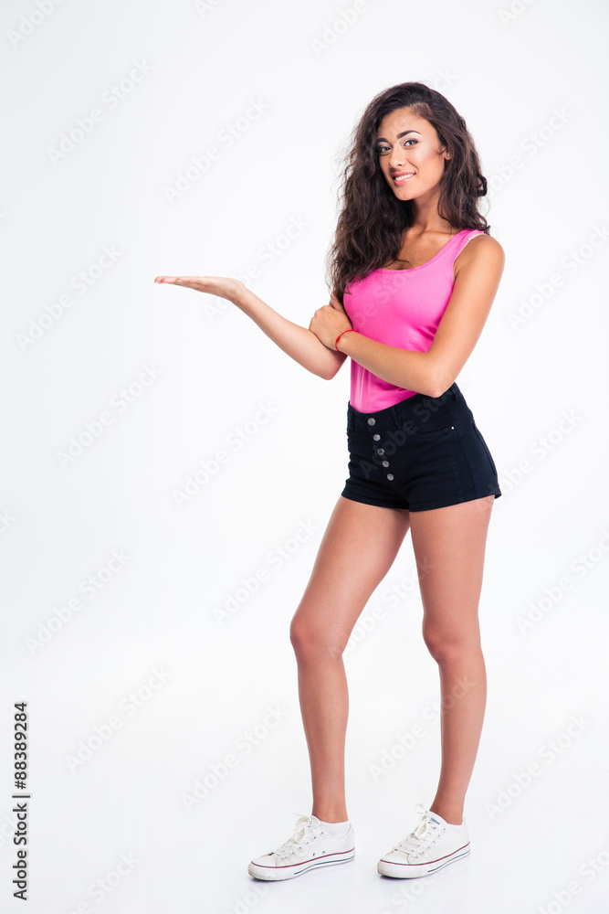 Happy female teenager holding copyspace on the palm