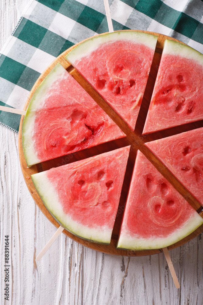 Pieces of ripe watermelon on a stick close-up. vertical top view
Pieces of ripe watermelon on a stick close-up. vertical top view