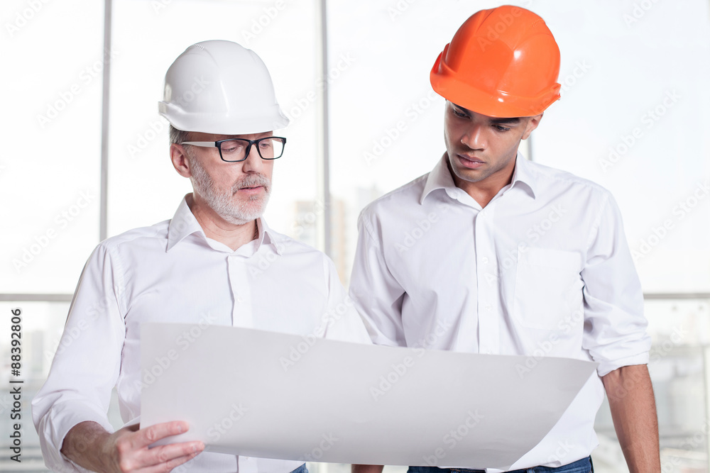 Successful workers are planning of building a new construction Successful workers are planning of building a new construction