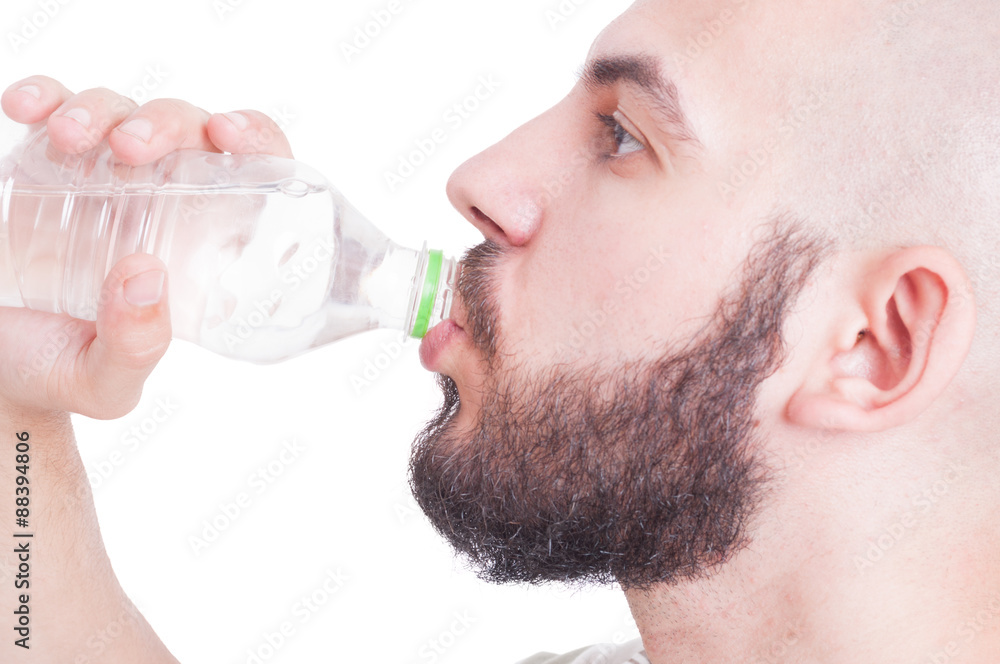 Close up with guy drinking water from plastic bottle Close up with guy drinking water from plastic bottle