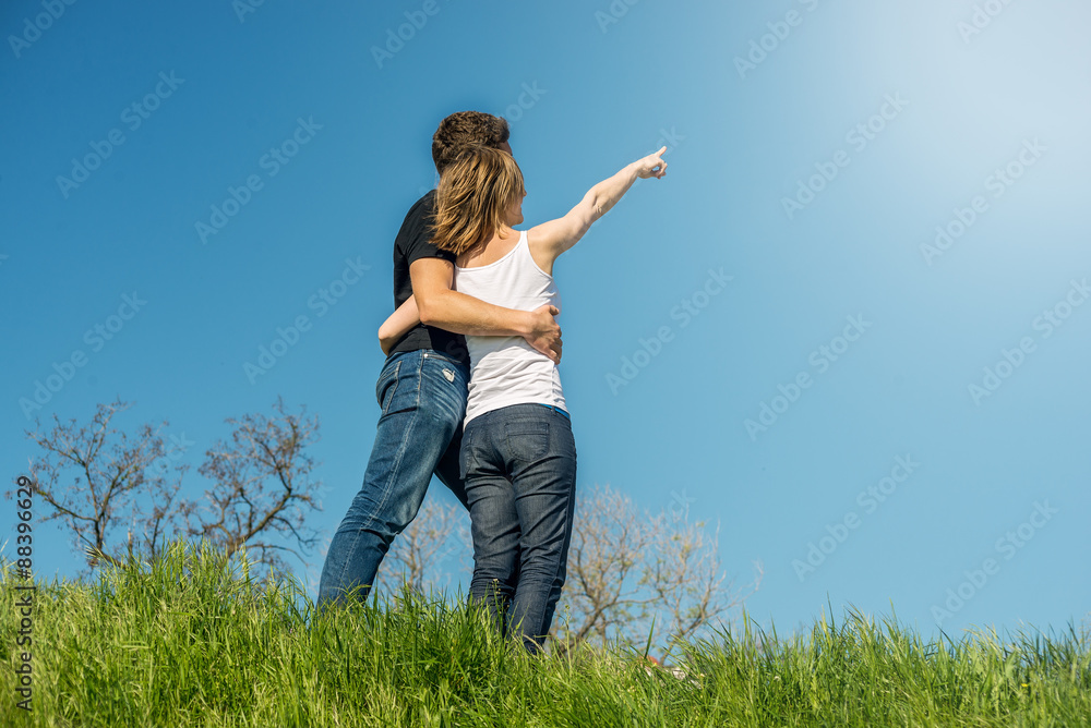Young couple standing on a beach Young couple standing on a beach