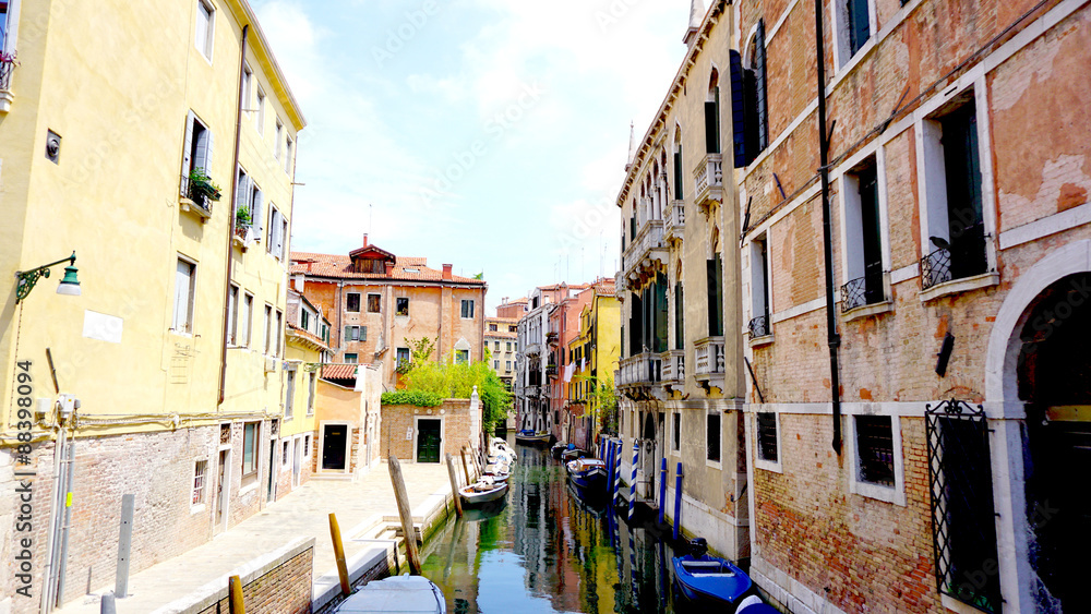 canal and boats with ancient architecture Venice