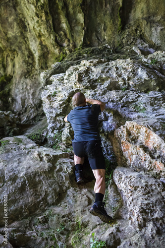Man climbing on rocky mountain