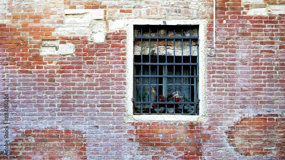 Window and old brick wall building