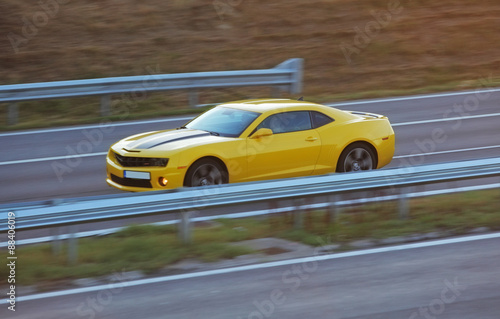 Yellow car on road © TTstudio