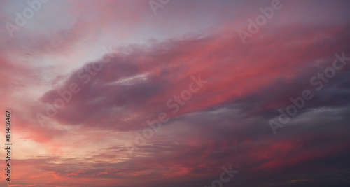 Dramatic sunset sky with orange colored clouds. © Vladimir Arndt