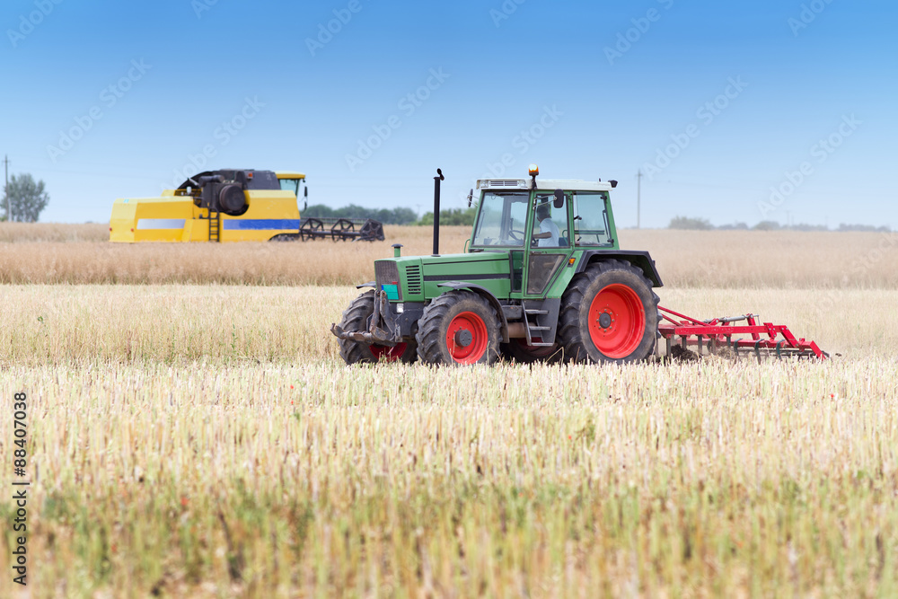 Fototapeta premium Agricultural machineries in the field