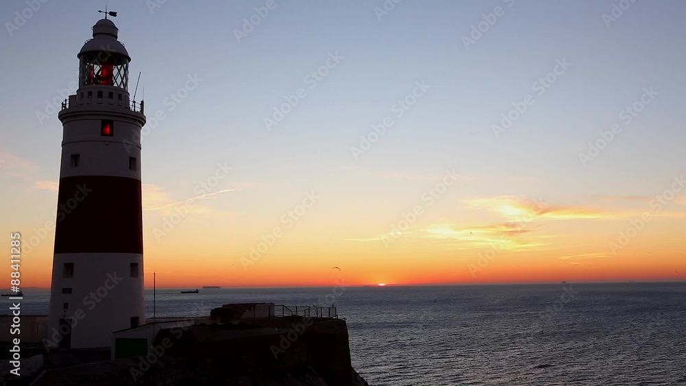 Lighthouse at Sunrise - Europa Point Lighthouse /Trinity Lighthouse at Europa Point, Bay of Gibraltar, Gibraltar. Lighthouse at Sunrise - Europa Point Lighthouse /Trinity Lighthouse at Europa Point, Bay of Gibraltar, Gibraltar.