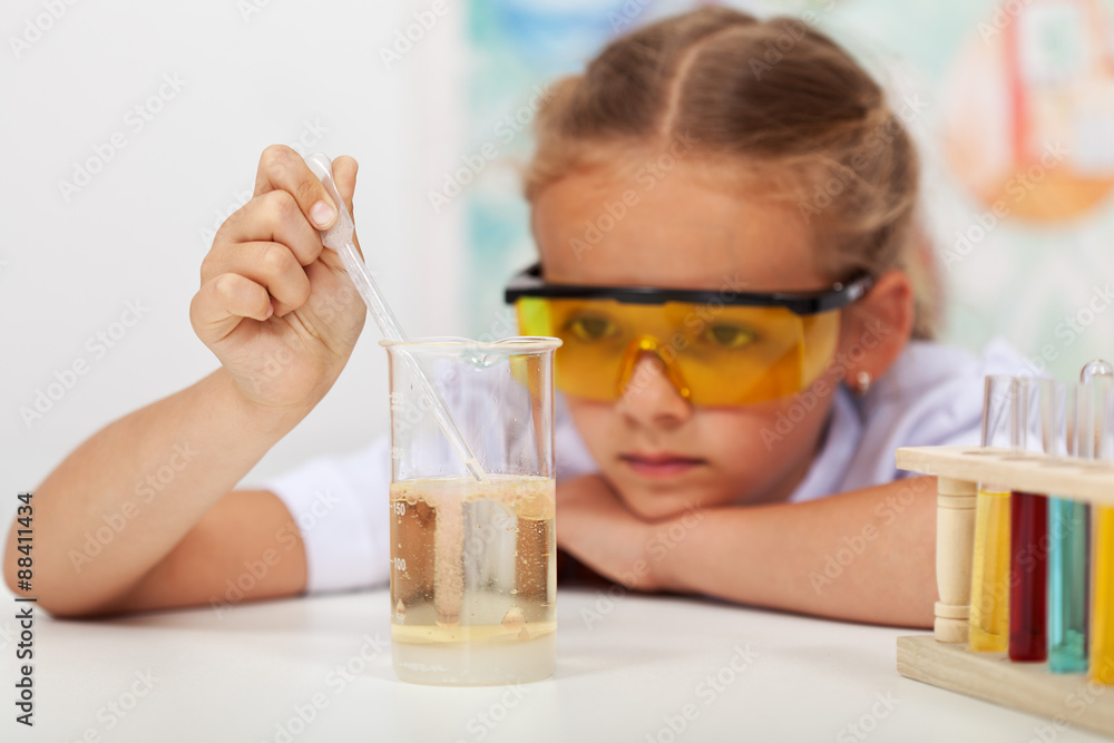 Little girl in chemistry class Little girl in chemistry class