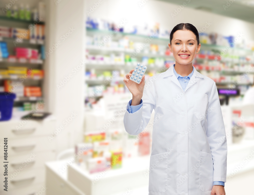 woman pharmacist with pills drugstore or pharmacy