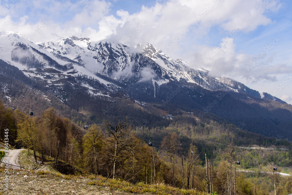 Snow-capped peaks of the Caucasus mountains and aerial ropeway ski resort 