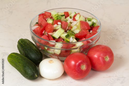 Vegetable salad with onion, tomato and cucumber