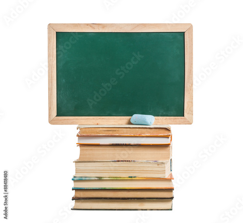 Still life with school books near blackboards on white