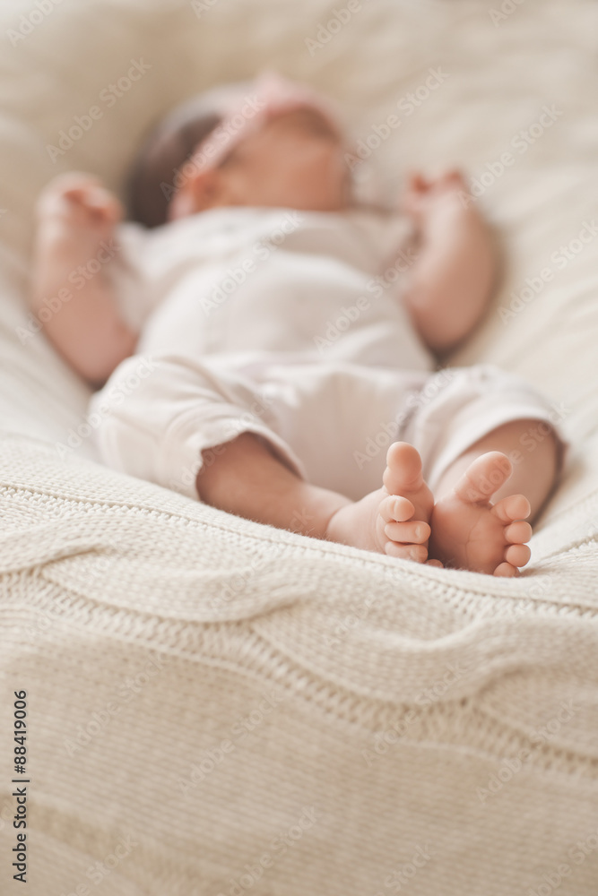 leg sleeping newborn