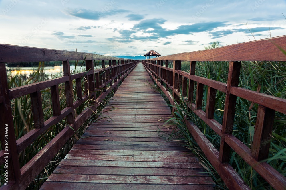Wooden bridge cross around marsh in sunset time at Sam Roi Yot National Park,Thailand Wooden bridge cross around marsh in sunset time at Sam Roi Yot National Park,Thailand