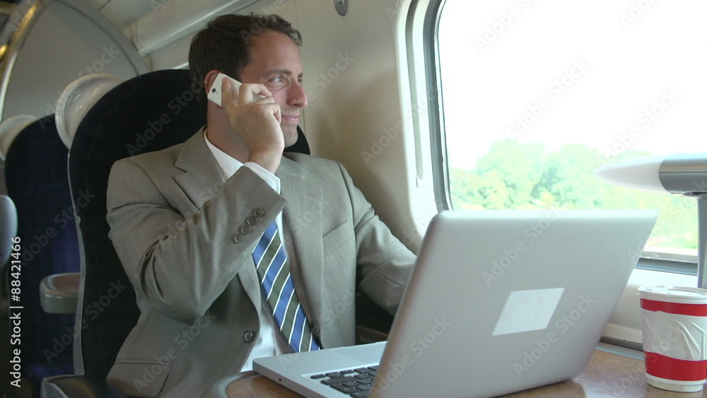 Businessman Commuting To Work On Train Using Mobile Phone
Businessman Commuting To Work On Train Using Mobile Phone