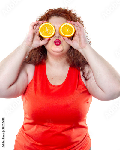 the fat woman with orange juice vegetable fruit holding isolated on the white background